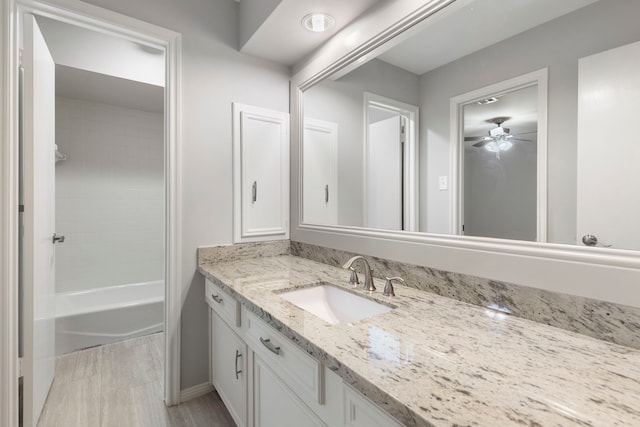 bathroom with vanity, ceiling fan, and bathtub / shower combination