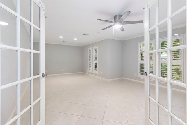spare room with ornamental molding, light tile patterned flooring, french doors, recessed lighting, and baseboards