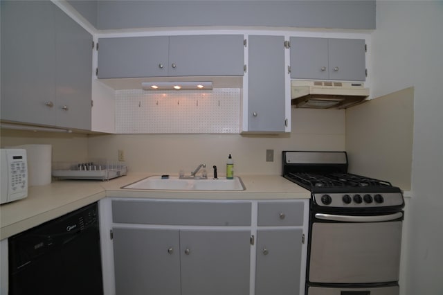 kitchen with a sink, gas stove, dishwasher, white microwave, and under cabinet range hood