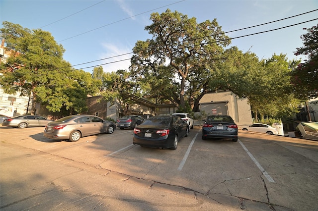obstructed view of property with uncovered parking