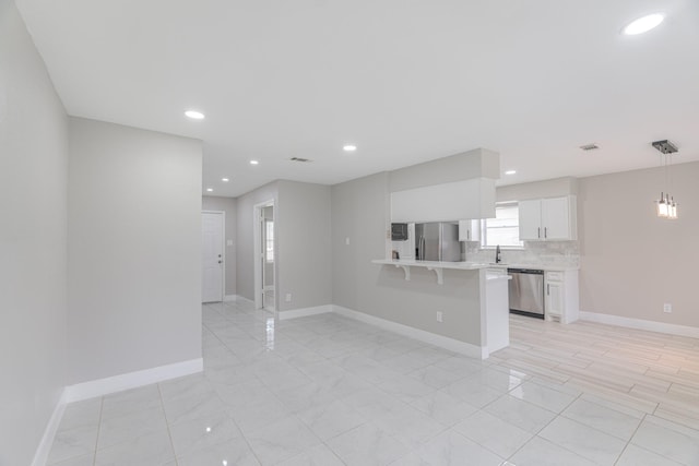 unfurnished living room featuring baseboards and recessed lighting