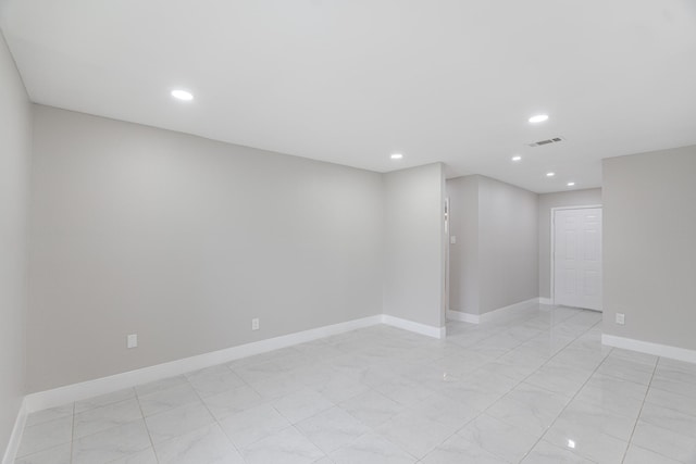 unfurnished room with baseboards, recessed lighting, and visible vents