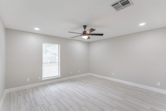 spare room with baseboards, ceiling fan, recessed lighting, and visible vents