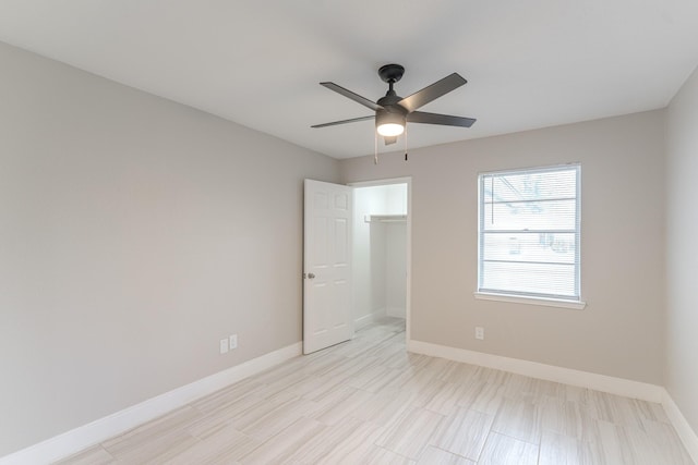 unfurnished bedroom featuring baseboards and a ceiling fan