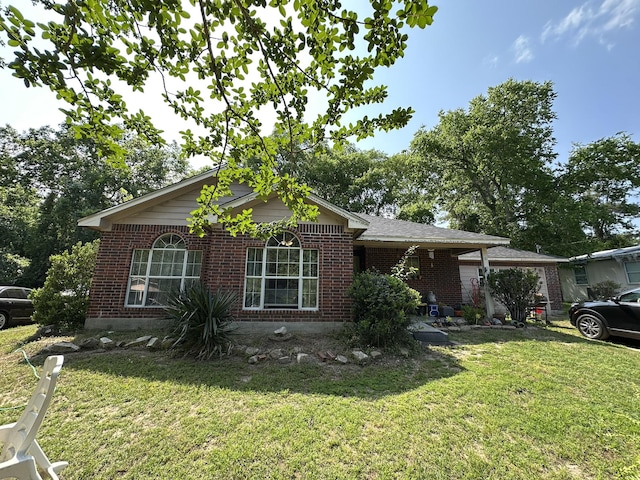 210 Lee St, Magnolia, TX 77354 - view of front of home with brick siding and a front yard