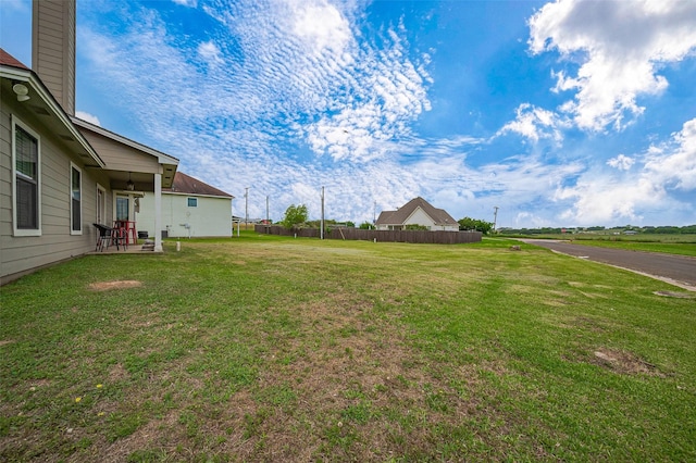view of yard with fence