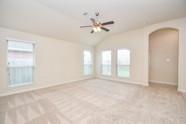 18007 Alora Springs Trce, Cypress, TX 77433 - empty room with arched walkways, plenty of natural light, lofted ceiling, ceiling fan, and baseboards