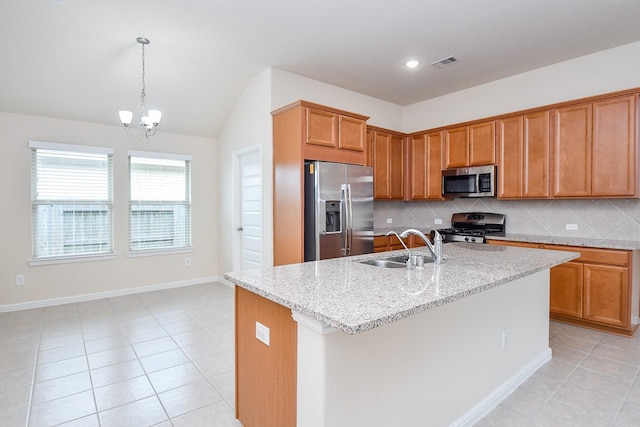 18007 Alora Springs Trce, Cypress, TX 77433 - kitchen with stainless steel appliances, a sink, light tile patterned floors, tasteful backsplash, and lofted ceiling