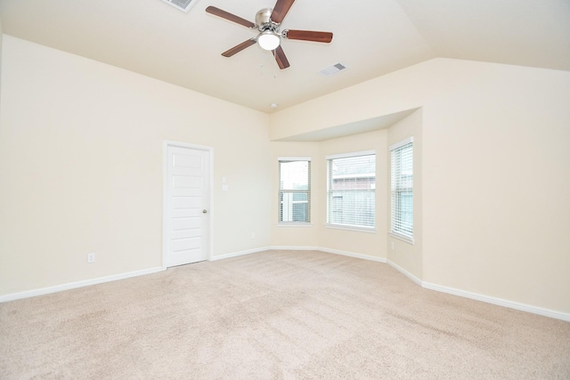 18007 Alora Springs Trce, Cypress, TX 77433 - spare room featuring a ceiling fan, light colored carpet, vaulted ceiling, and baseboards