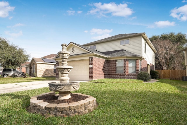 traditional home with brick siding, a garage, a front lawn, and fence