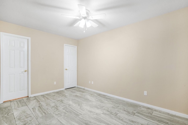 unfurnished bedroom with baseboards and a ceiling fan