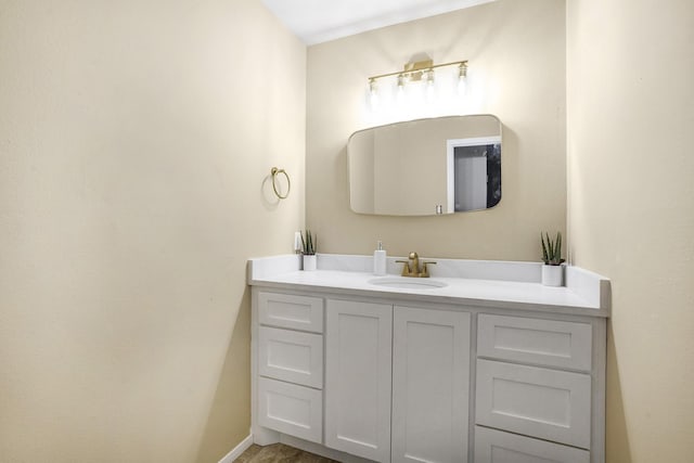 bathroom with vanity and baseboards