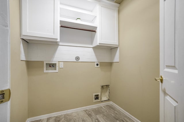 clothes washing area with cabinet space, electric dryer hookup, baseboards, and hookup for a washing machine