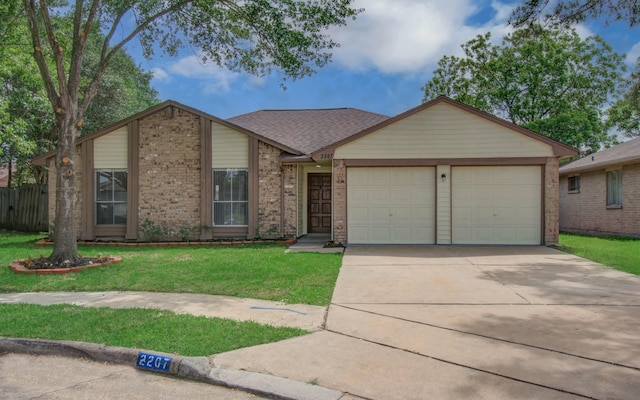 view of front facade featuring concrete driveway, brick siding, a front yard, and a garage