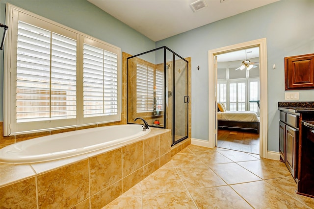 bathroom featuring a garden tub, visible vents, a shower stall, tile patterned floors, and ensuite bathroom