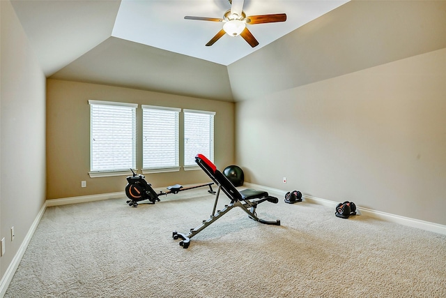 exercise room with a ceiling fan, baseboards, and carpet