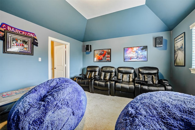 carpeted cinema room with lofted ceiling