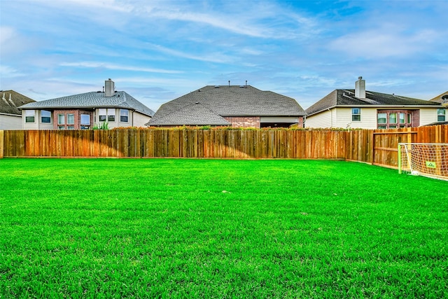 view of yard featuring a fenced backyard