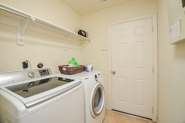 5018 Tramonte Trl, Katy, TX 77494 - laundry room with laundry area, light tile patterned floors, and washer and dryer