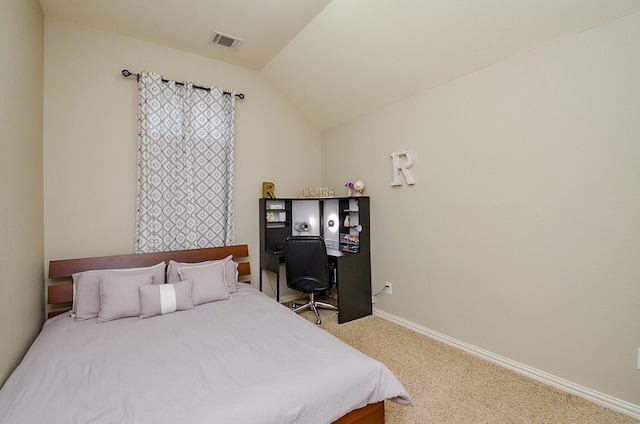 carpeted bedroom featuring baseboards, vaulted ceiling, and visible vents