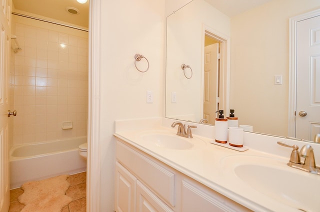 5018 Tramonte Trl, Katy, TX 77494 - full bathroom with double vanity, toilet, tub / shower combination, and a sink