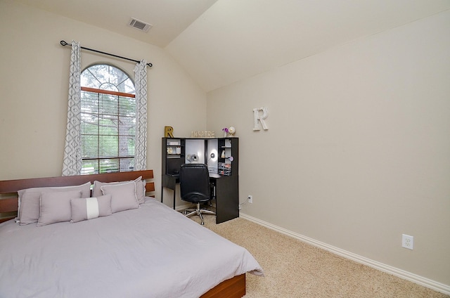 carpeted bedroom featuring visible vents, baseboards, and vaulted ceiling