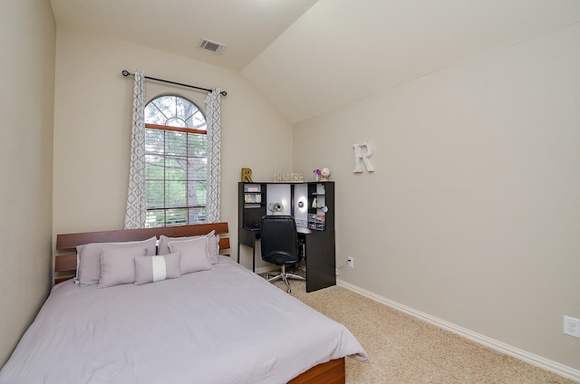 carpeted bedroom with baseboards, lofted ceiling, and visible vents