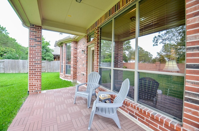 view of patio / terrace featuring fence