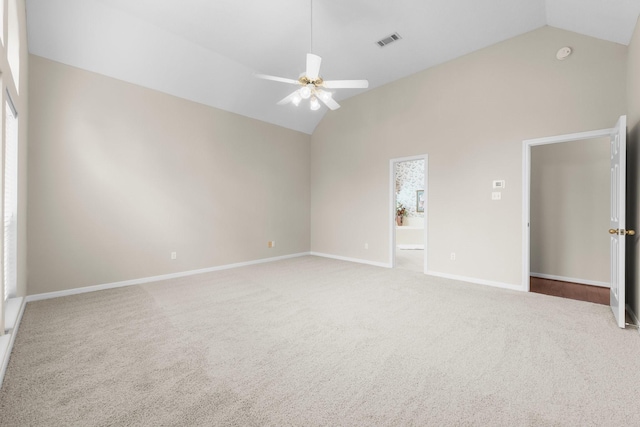 unfurnished bedroom with baseboards, visible vents, carpet, and lofted ceiling