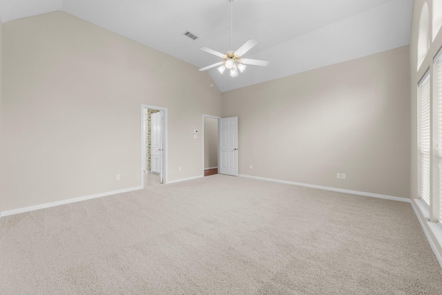 interior space featuring visible vents, baseboards, and light carpet