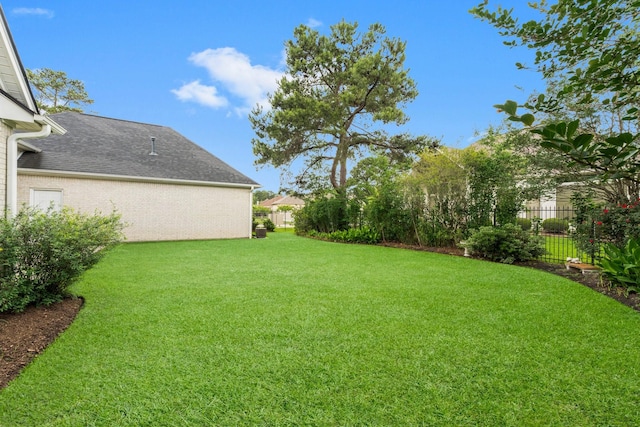 view of yard with fence