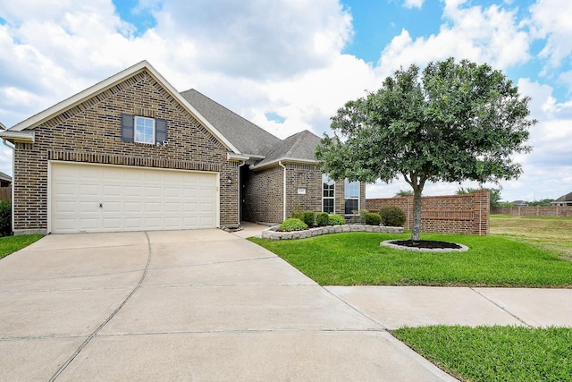view of front of property with a garage, a front lawn, brick siding, a shingled roof, and driveway