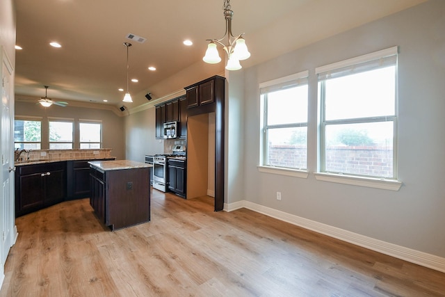 kitchen with visible vents, baseboards, recessed lighting, light wood-style flooring, and stainless steel appliances