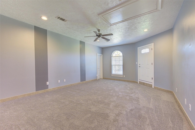 1321 E Archer Rd, Baytown, TX 77521 - spare room with ceiling fan, attic access, a textured ceiling, visible vents, and carpet flooring