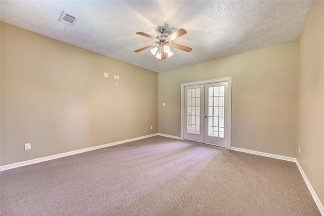 1321 E Archer Rd, Baytown, TX 77521 - carpeted spare room with visible vents, baseboards, a textured ceiling, french doors, and a ceiling fan