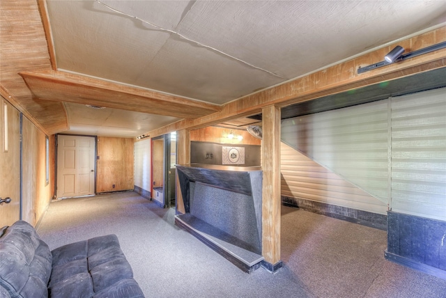 unfurnished living room with carpet floors and baseboards