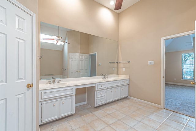 full bath featuring a ceiling fan, a sink, and tile patterned floors
