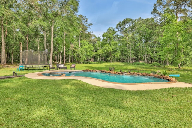 view of property's community featuring a lawn, a swimming pool, and a trampoline