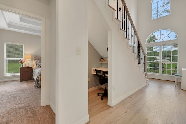 stairs with baseboards and wood finished floors