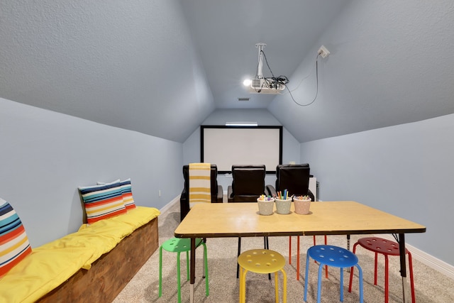 interior space with baseboards, lofted ceiling, and visible vents
