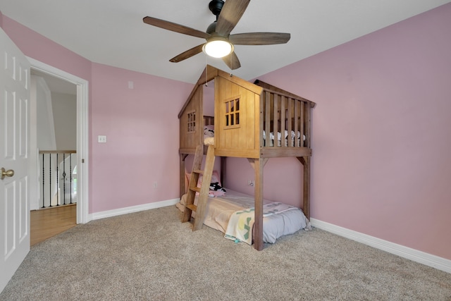 bedroom with baseboards, carpet, and a ceiling fan