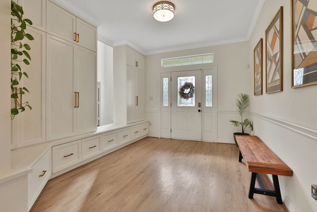 mudroom featuring crown molding and light wood-type flooring