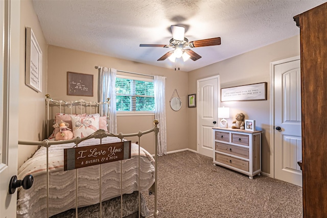 bedroom featuring carpet flooring, a ceiling fan, a textured ceiling, and baseboards