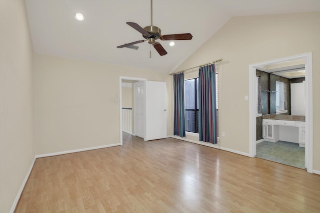 7447 Cambridge St, Houston, TX 77054 - empty room with ceiling fan, lofted ceiling, plenty of natural light, and light wood-style flooring