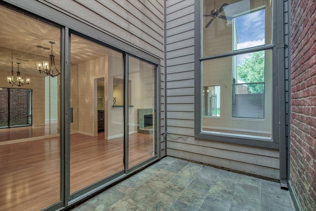7447 Cambridge St, Houston, TX 77054 - unfurnished sunroom featuring a chandelier and ceiling fan