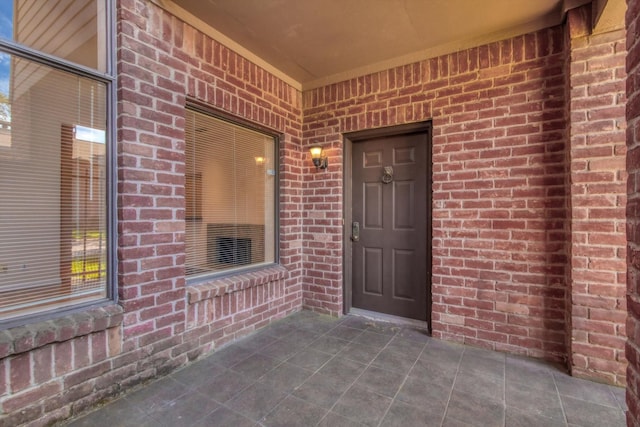 7447 Cambridge St, Houston, TX 77054 - doorway to property featuring brick siding
