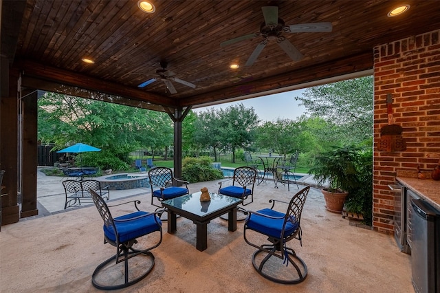 view of patio / terrace featuring a fire pit and a ceiling fan
