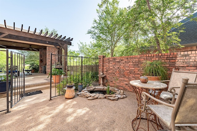 view of patio / terrace featuring fence, a ceiling fan, and a pergola