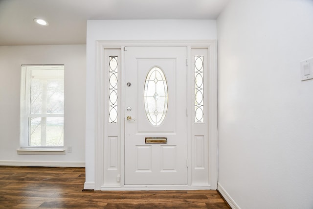 foyer featuring dark wood-style flooring, baseboards, and recessed lighting