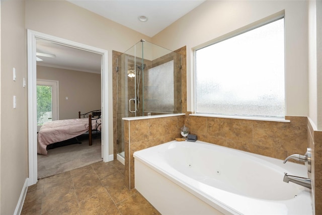 ensuite bathroom with ornamental molding, a jetted tub, baseboards, ensuite bathroom, and a stall shower